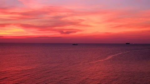 Dramatic sunset seascape pink and orange sky twilight view with silhouette Stock Footage 92534688