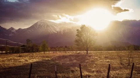Dramatic sunset in Sierra Nevada's rays of light and clouds 写真素材
