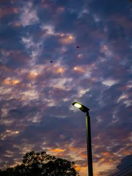Dramatic Sunset Sky with Altocumulus Clouds in Purple, Orange, and Blue Col.. Stock-Fotos