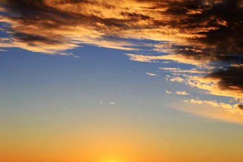 Dramatic sunset sky and beautiful clouds Stock Photos
