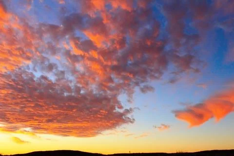 Dramatic sunset sky and beautiful clouds Stock Photos