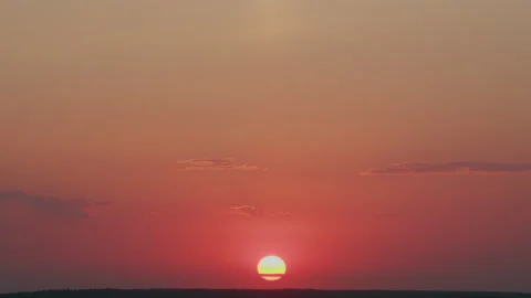 Dramatic sunset sky background. Colorful sky in evening. Big bright yellow sun Stock Footage 219280195