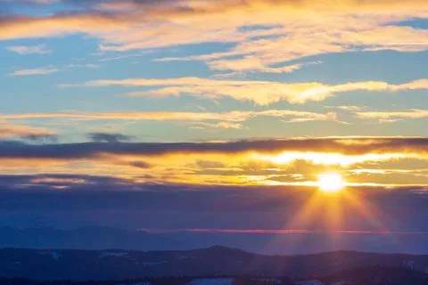 Dramatic sunset sky with clouds. Dramatic sunset over the sea Stock Photos