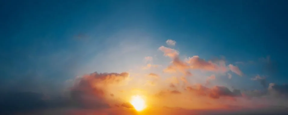 Dramatic sunset sky with clouds. Natural background. Stock Photos