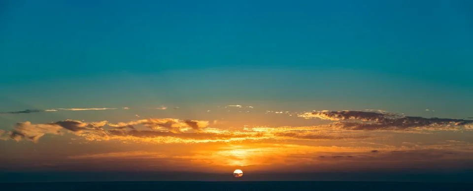 Dramatic sunset sky with clouds Stock Photos