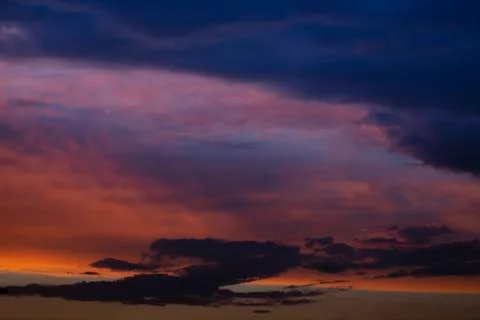 Dramatic sunset sky with clouds Stock Photos