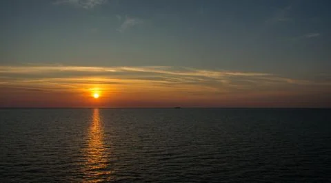 Dramatic sunset sky with clouds. Stock Photos