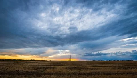 Dramatic sunset sky with clouds. Rural landscapes Stock Photos