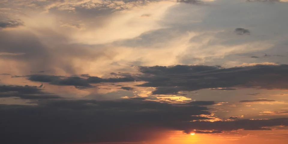 Dramatic sunset sky. Cloudy sky as a background. Stock Illustration