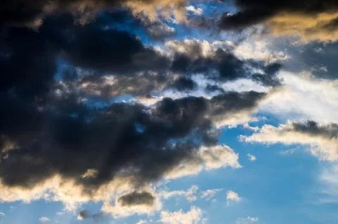 Dramatic sunset sky with colorful clouds after thunderstorm Stock Photos