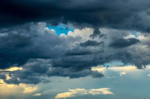 Dramatic sunset sky with colorful clouds after thunderstorm Stock Photos