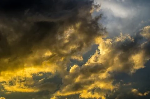 Dramatic sunset sky with colorful clouds after thunderstorm Stock Photos