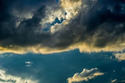 Dramatic sunset sky with colorful clouds after thunderstorm Stock Photos