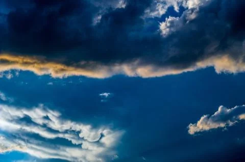 Dramatic sunset sky with colorful clouds after thunderstorm Stock Photos