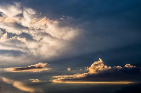 Dramatic sunset sky with colorful clouds after thunderstorm Stock Photos