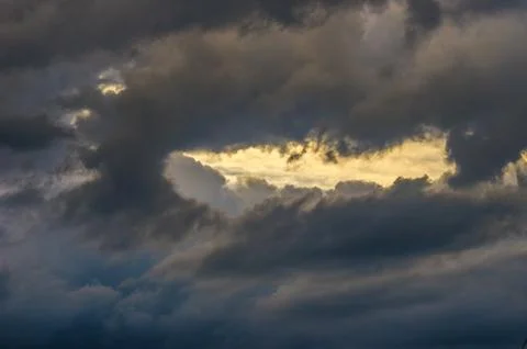 Dramatic sunset sky with colorful clouds after thunderstorm Stock Photos