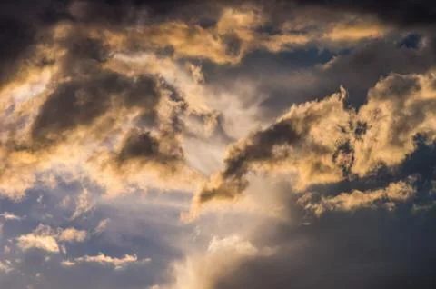 Dramatic sunset sky with colorful clouds after thunderstorm Stock Photos