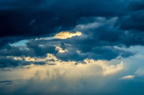 Dramatic sunset sky with colorful clouds after thunderstorm Stock Photos