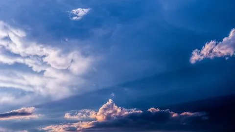 Dramatic sunset sky with colorful clouds after thunderstorm Stock Photos