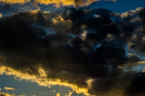 Dramatic sunset sky with colorful clouds after thunderstorm Stock Photos