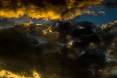 Dramatic sunset sky with colorful clouds after thunderstorm Stock Photos