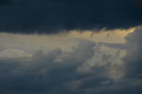 Dramatic sunset sky with colorful clouds after thunderstorm Stock Photos