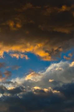 Dramatic sunset sky with colorful clouds after thunderstorm Stock Photos