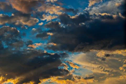 Dramatic sunset sky with colorful clouds after thunderstorm Stock Photos