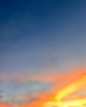 Dramatic sunset sky with colorful clouds background concept. Evening sunset Stock Photos