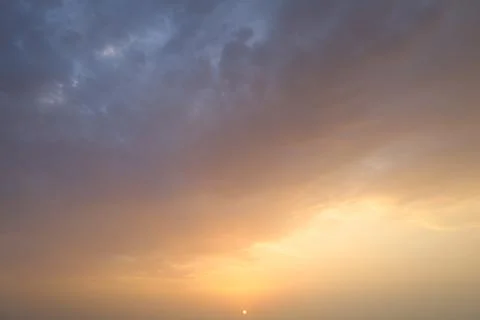 Dramatic sunset sky with colorful clouds at dusk. Nature background and tex.. Stock Photos