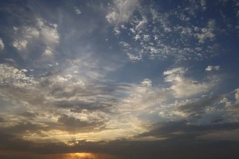 Dramatic sunset sky with colorful clouds at dusk. Nature background and tex.. Stock Photos