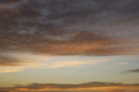 Dramatic sunset sky with colorful clouds at dusk. Nature background and tex.. Stock Photos