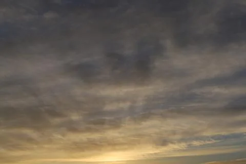 Dramatic sunset sky with colorful clouds at dusk. Nature background and tex.. Stock Photos