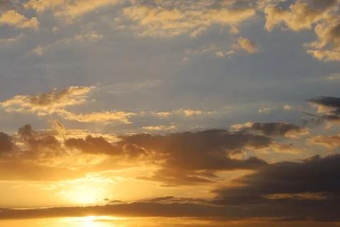 Dramatic sunset sky with colorful clouds at dusk. Nature background and tex.. Stock Photos