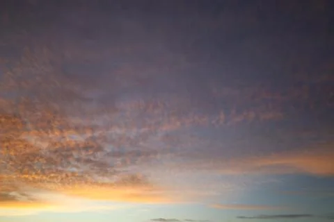 Dramatic sunset sky with colorful clouds at dusk. Nature background and tex.. Stock Photos