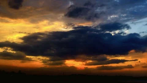Dramatic Sunset Sky with Dark Clouds and Vivid Colors Stock Footage 311528949