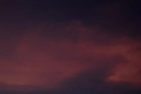 Dramatic sunset sky with dark clouds Stock Photos