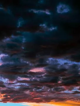 Dramatic Sunset Sky with Dark Storm Clouds Stock Photos