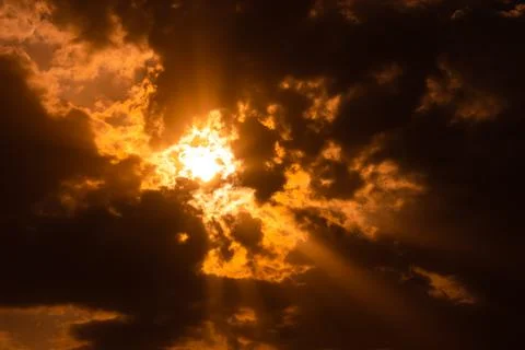 Dramatic sunset sky with dense black cloud at dusk Stock Photos