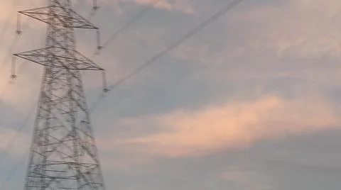 Dramatic sunset sky with dramatic clouds and electric tower Stock Photos