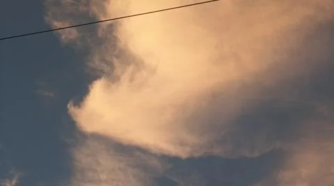 Dramatic sunset sky with dramatic clouds and electric tower Stock Photos