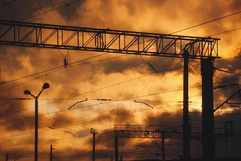 Dramatic sunset sky with electric and railroad lines Stock Photos