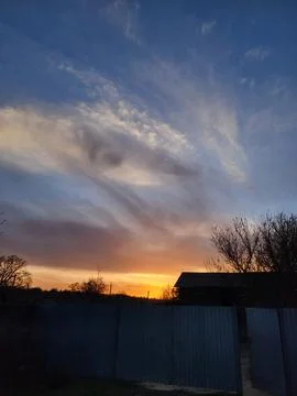 Dramatic sunset sky with expressive clouds Stock Photos