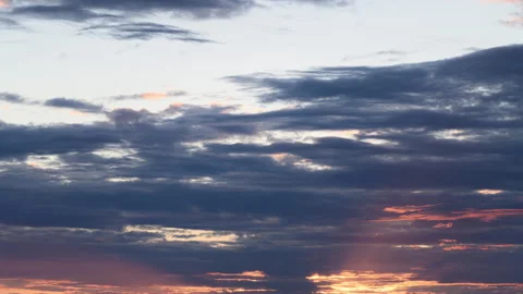 Dramatic Sunset Sky featuring Colorful Clouds that paint the horizon with vibran Stock Footage 316057686