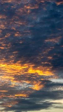 Dramatic Sunset Sky with Fiery Clouds 스톡 사진