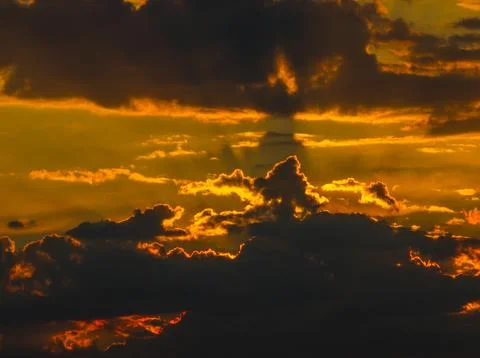 Dramatic Sunset Sky with Fiery Clouds and Light Rays Stock-Fotos