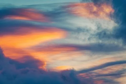Dramatic Sunset Sky with Fiery Orange and Blue Clouds Texture Stock Photos