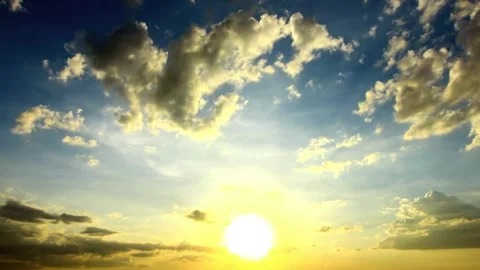 Dramatic Sunset Sky with Golden Hues and Cumulus Clouds Stock Footage 310817389