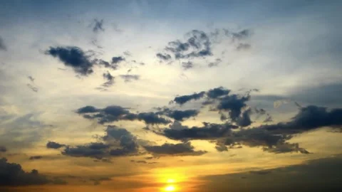 Dramatic Sunset Sky with Golden Hues and Dark Clouds Stock Footage 310817869