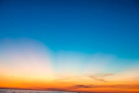 Dramatic sunset sky with golden rays. Nature background Stock Photos